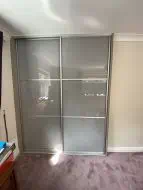 2 door sliding wardrobe in Storm grey coloured glass with brushed silver frames, fitted in Eaglescliffe